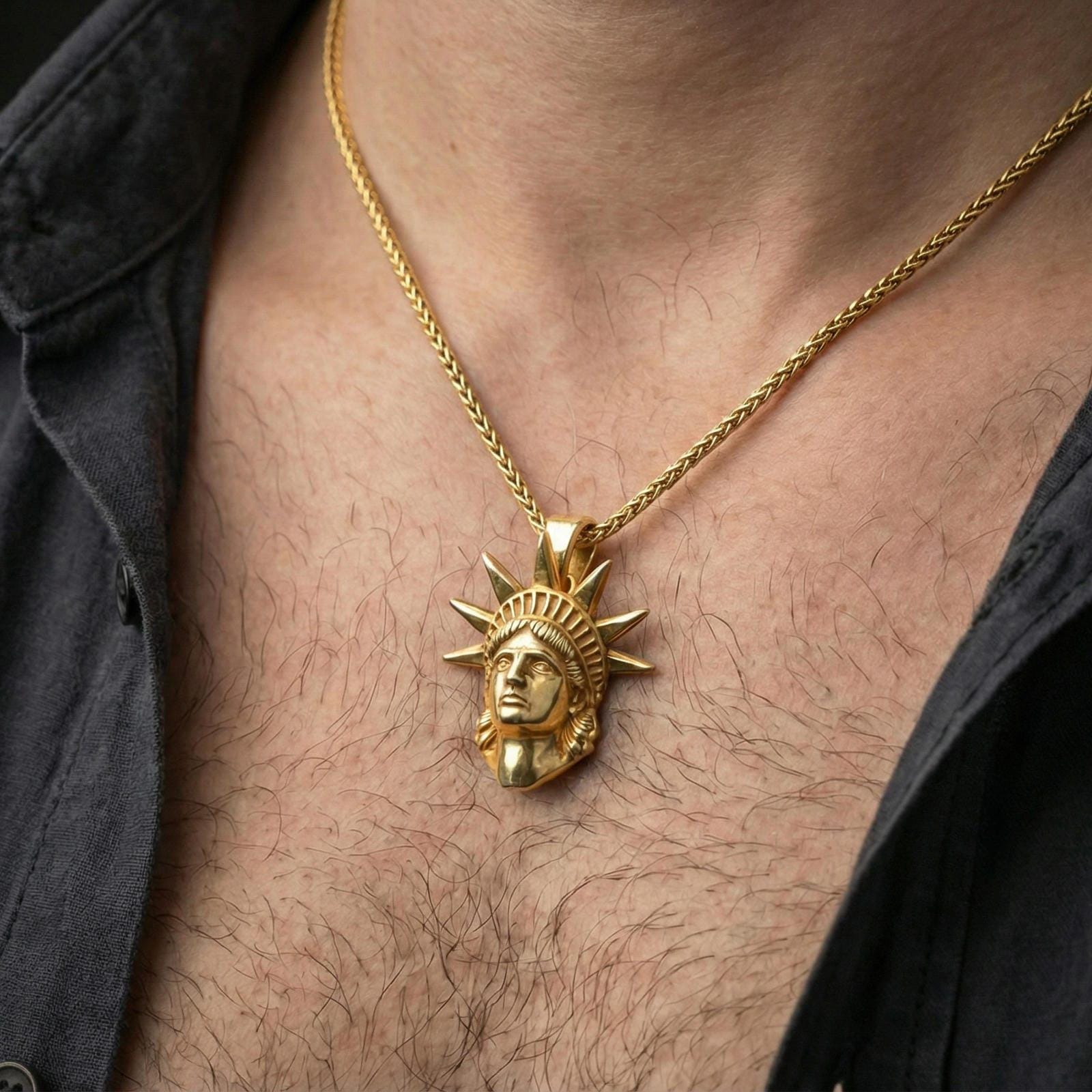 Gold plated Statue of Liberty pendant worn on a human neck, NYC souvenir charm, braided chain necklace