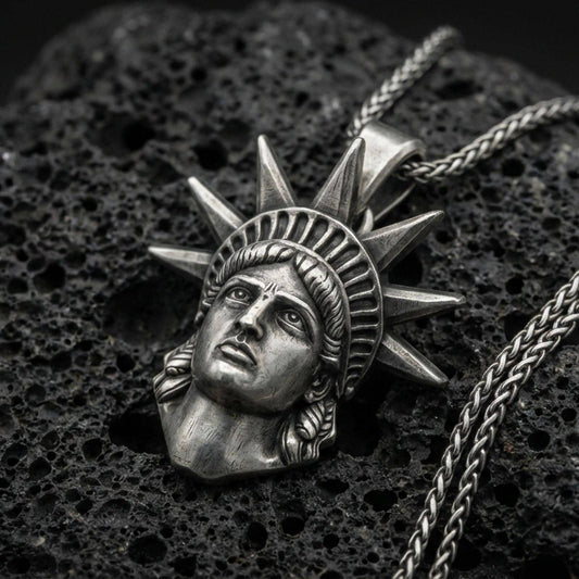 Oxidized sterling silver Statue of Liberty pendant on black volcanic stone, NYC skyline charm, braided chain necklace