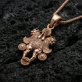 Load image into Gallery viewer, Rose gold plated Assyrian lamassu pendant on black volcanic stone, Assyrian protective beast necklace, braided chain
