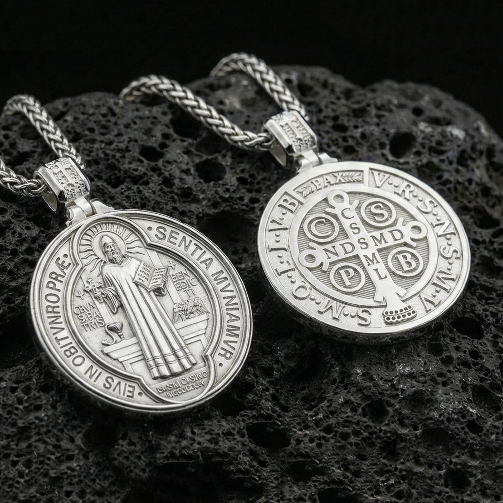 Polished sterling silver St. Benedict medal necklace on black volcanic stone, sacred Christian devotional pendant, braided chain