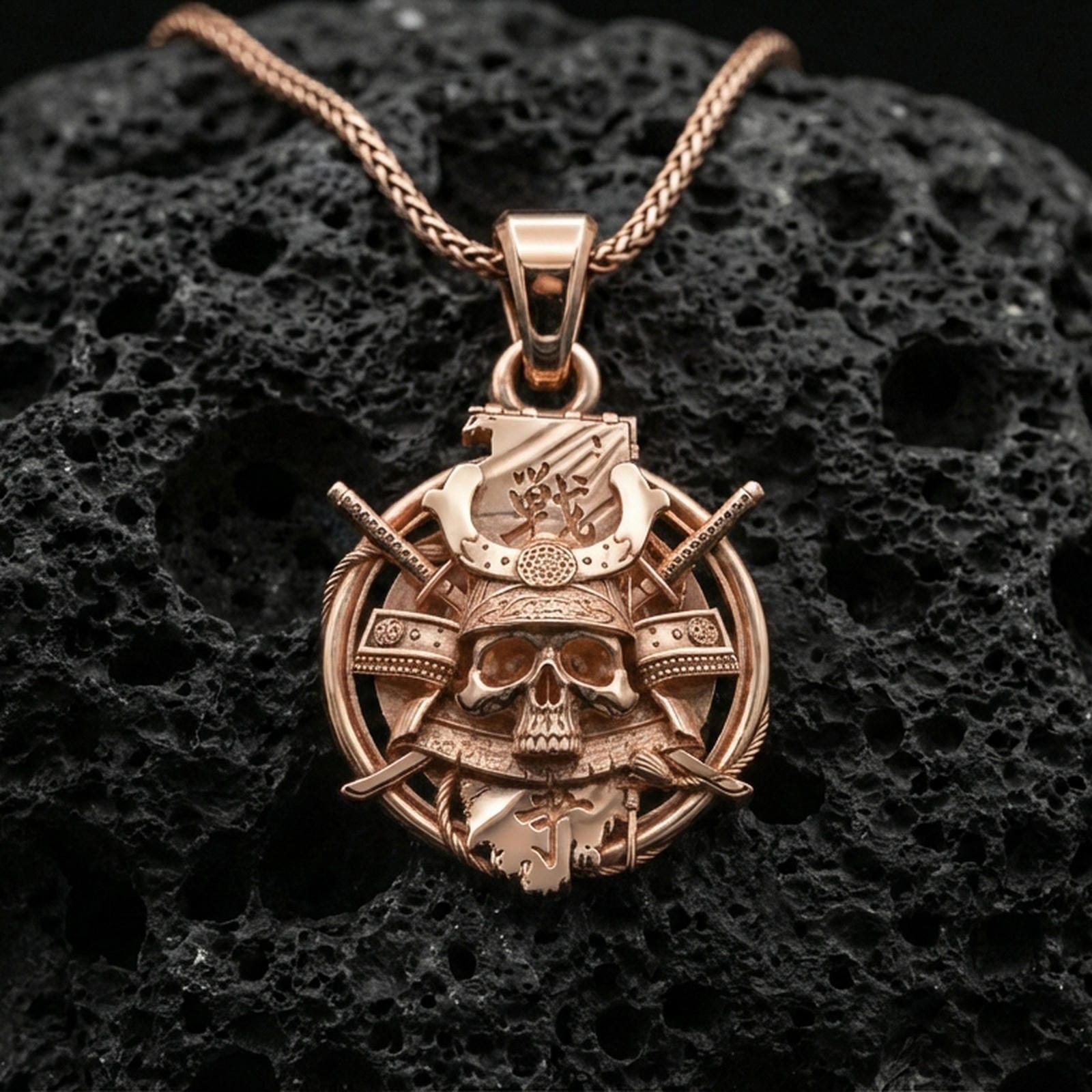 Rose gold plated samurai skull necklace pendant on volcanic stone, shogun-inspired kabuto skull and katana motif