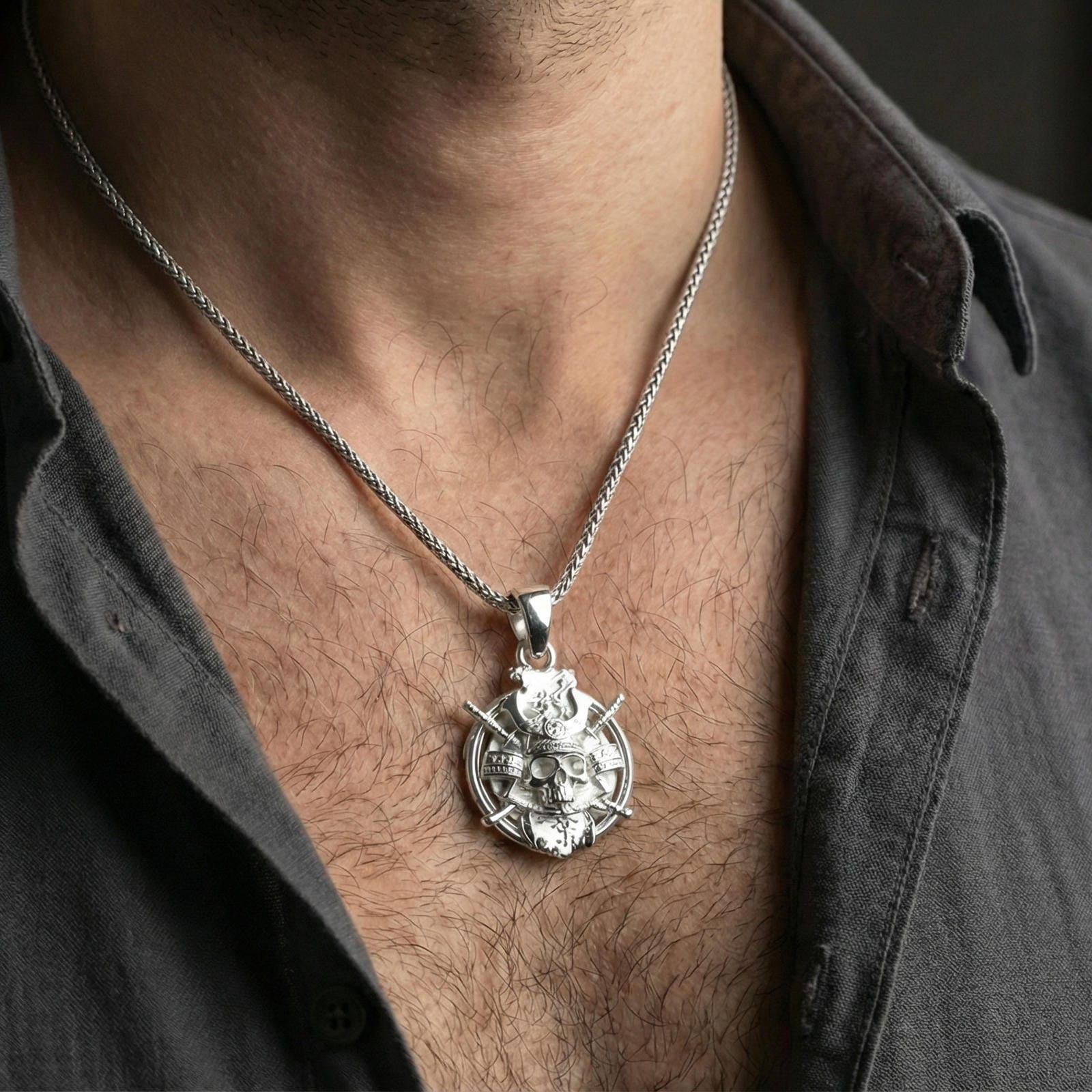 Polished sterling silver samurai skull pendant on a human neck, Japanese warrior kabuto skull necklace for edgy styling
