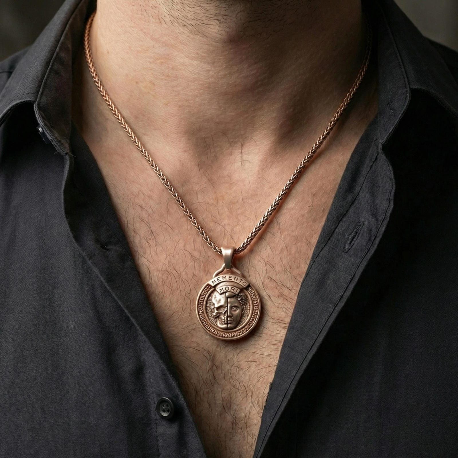 Rose gold plated memento mori coin pendant worn on neck, detailed relief centerpiece, clean lifestyle framing with dark shirt contrast