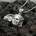 Load image into Gallery viewer, Polished silver Hypnos medallion pendant on dark volcanic stone, crisp facial sculpture and wing relief, premium close-up composition

