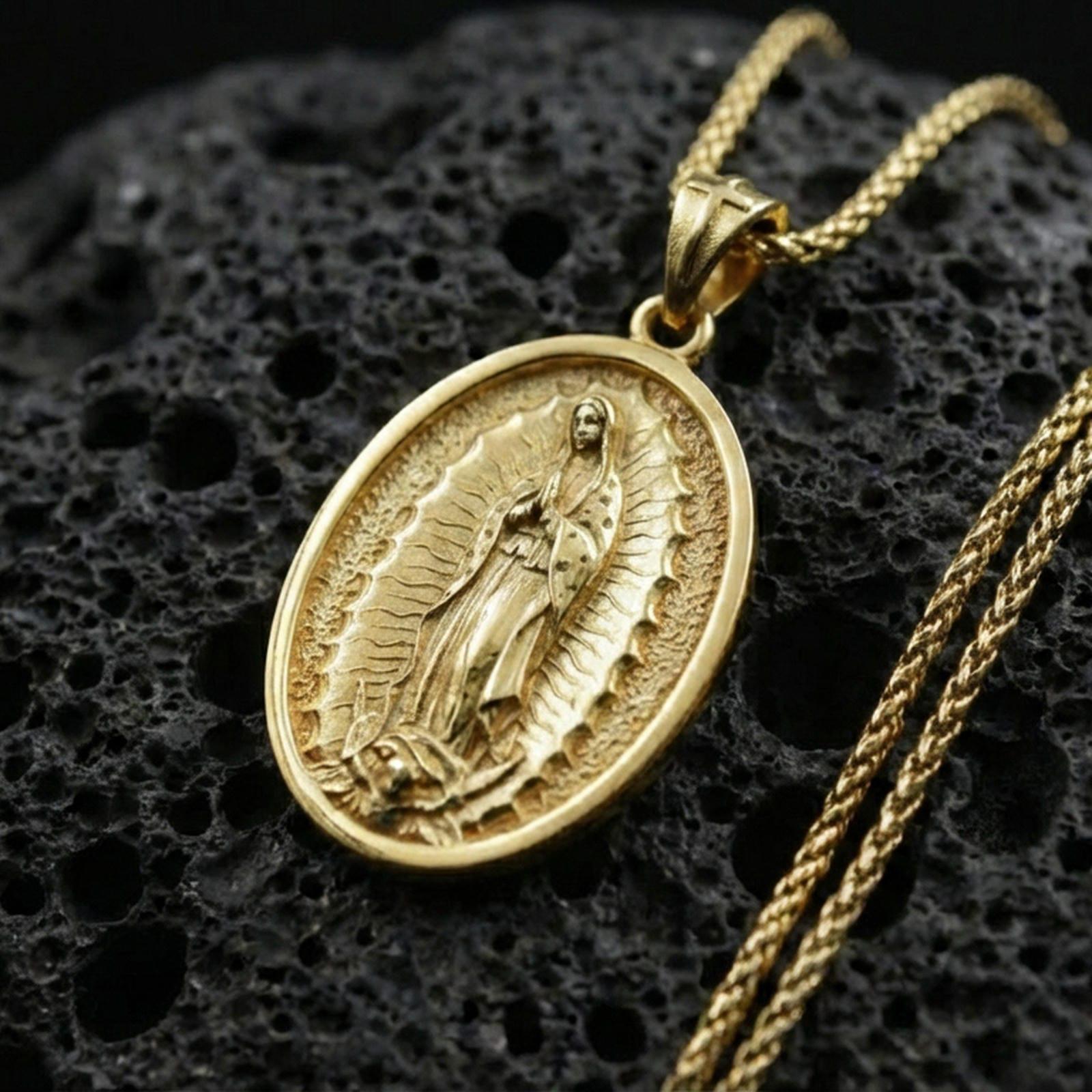 Gold plated Our Lady of Guadalupe pendant on porous volcanic rock backdrop, oval devotional medallion with detailed relief, high-contrast lighting