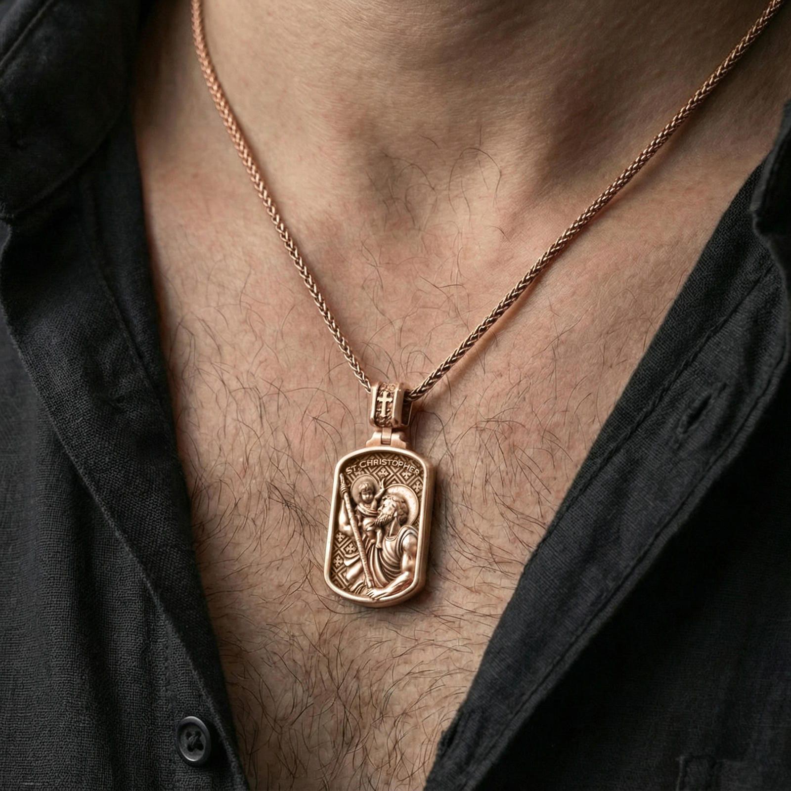 Rose gold plated St Christopher pendant worn on neck, detailed saint and child relief, clean lifestyle framing with dark shirt contrast