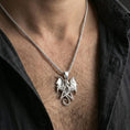 Load image into Gallery viewer, Polished silver dragon pentagram necklace worn on neck, close lifestyle crop, clear star outline and dragon wing details
