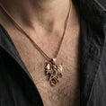 Load image into Gallery viewer, Rose gold plated dragon pentagram pendant worn on neck, detailed wing and scale relief, clean lifestyle framing with dark shirt contrast
