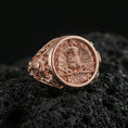 Load image into Gallery viewer, Rose gold plated roman eagle ring on porous volcanic rock, premium studio lighting with shallow depth of field
