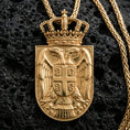 Load image into Gallery viewer, Gold plated Republic of Serbia coat of arms pendant on volcanic rock, patriotic crowned double headed eagle medallion
