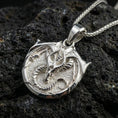 Load image into Gallery viewer, Polished silver dragon pendant on volcanic rock, sharp horned dragon head relief fantasy charm necklace
