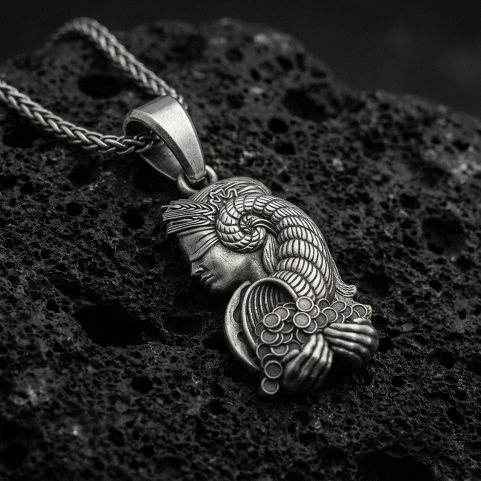 Oxidized sterling silver Fortuna goddess pendant on volcanic rock, Roman luck deity necklace, detailed relief