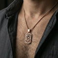 Load image into Gallery viewer, Rose gold plated dragon phoenix yin yang pendant worn on neck, symbolic balance necklace, elegant lifestyle photo
