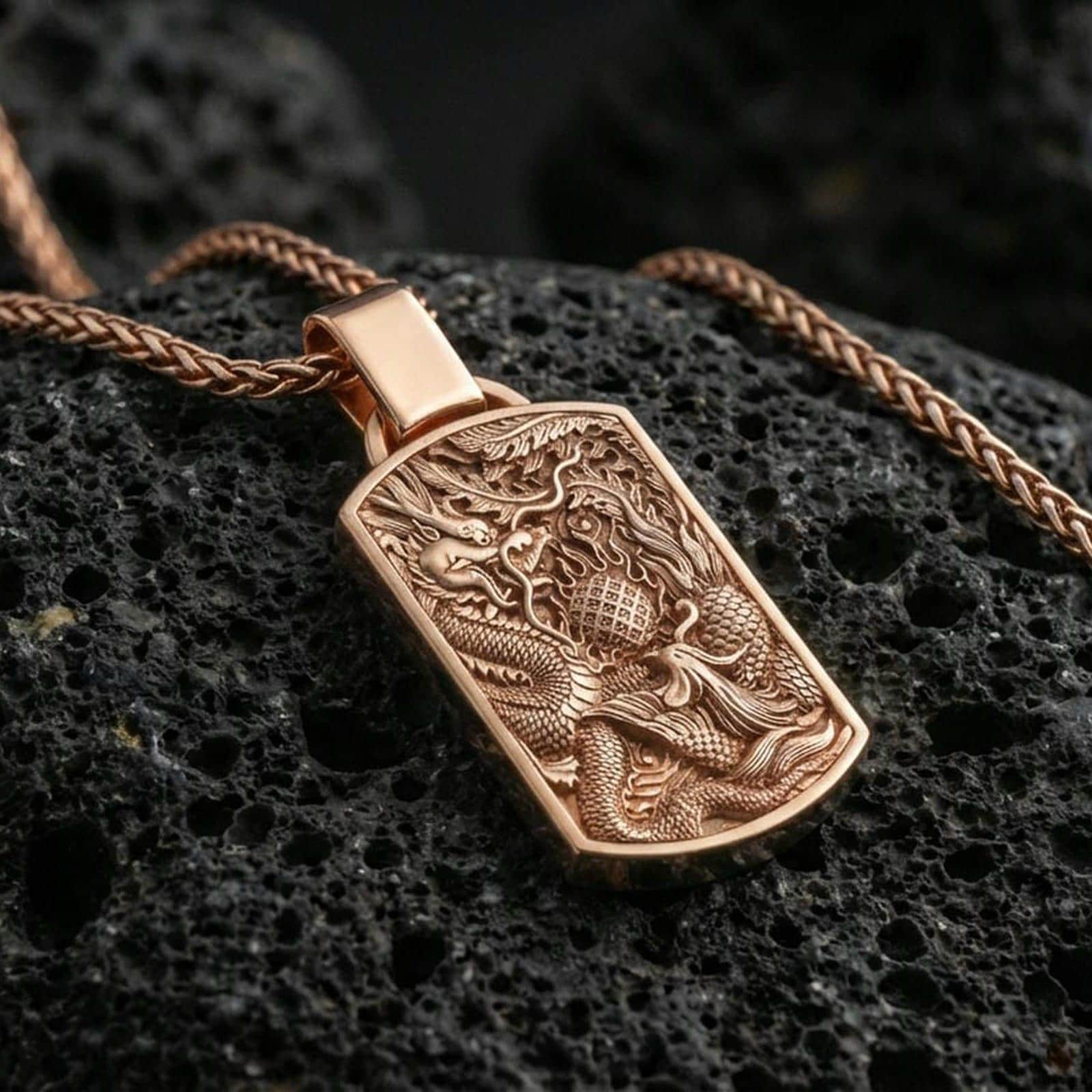 Rose gold plated dragon phoenix yin yang pendant on volcanic stone, mythic harmony necklace, studio macro lighting