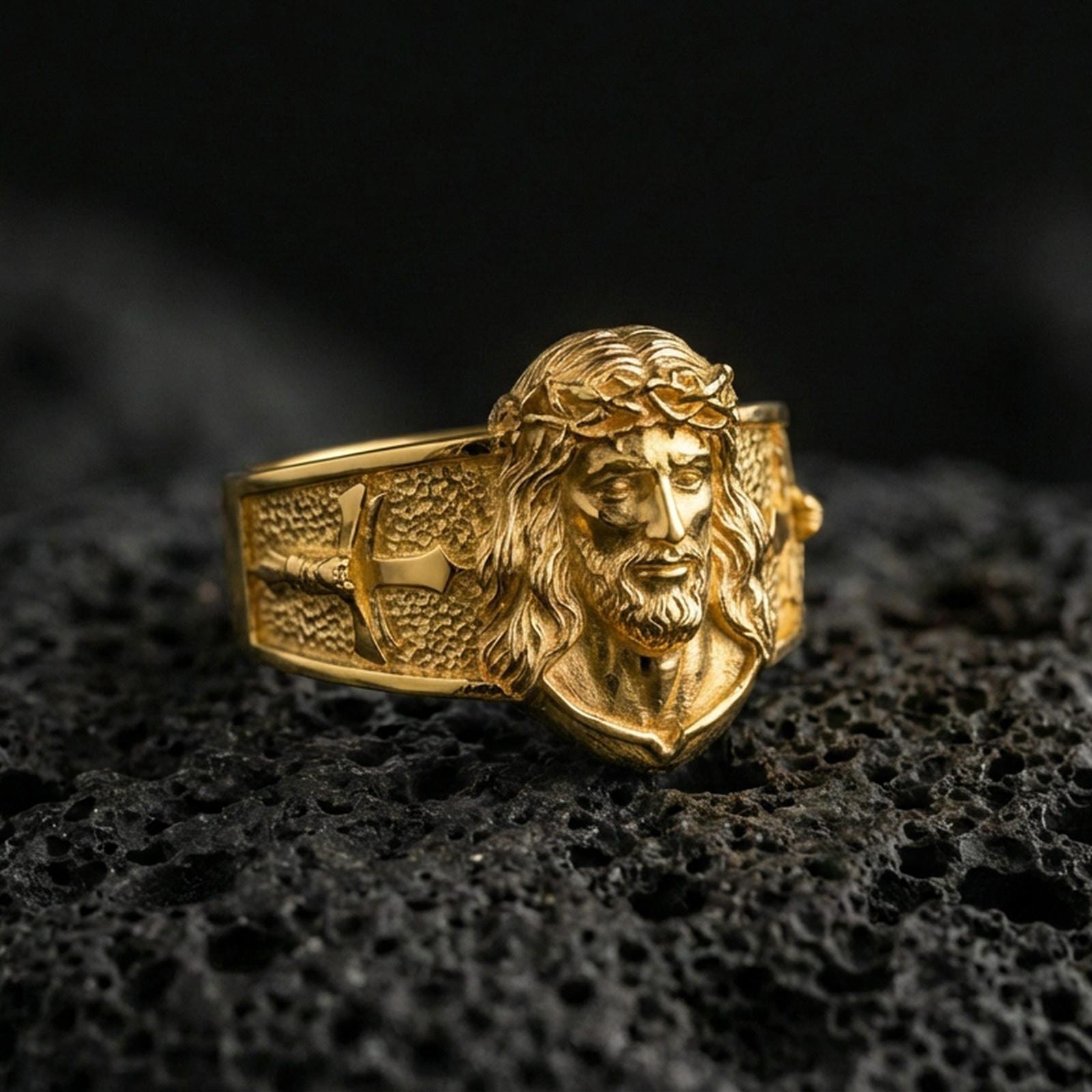 Gold plated Jesus Christ ring on dark volcanic rock, sacred portrait ring, cross side detail, religious statement jewelry