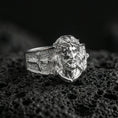 Load image into Gallery viewer, Polished silver Jesus Christ ring on porous volcanic stone, detailed Christ head engraving, Christian mens ring close-up
