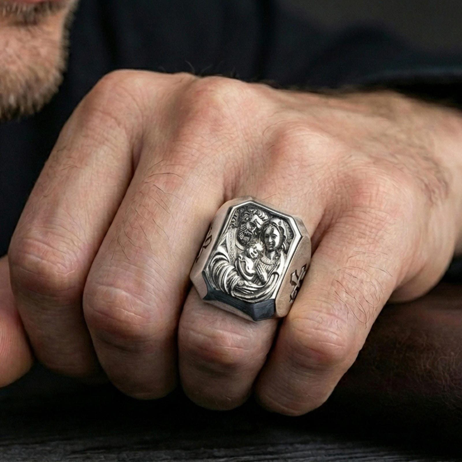 Polished silver Holy Family signet ring worn on finger, Catholic family portrait ring, Christian religious jewelry lifestyle