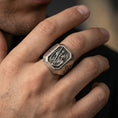Load image into Gallery viewer, Oxidized sterling silver St Christopher ring worn on finger, traveler saint relief signet, cross side detail
