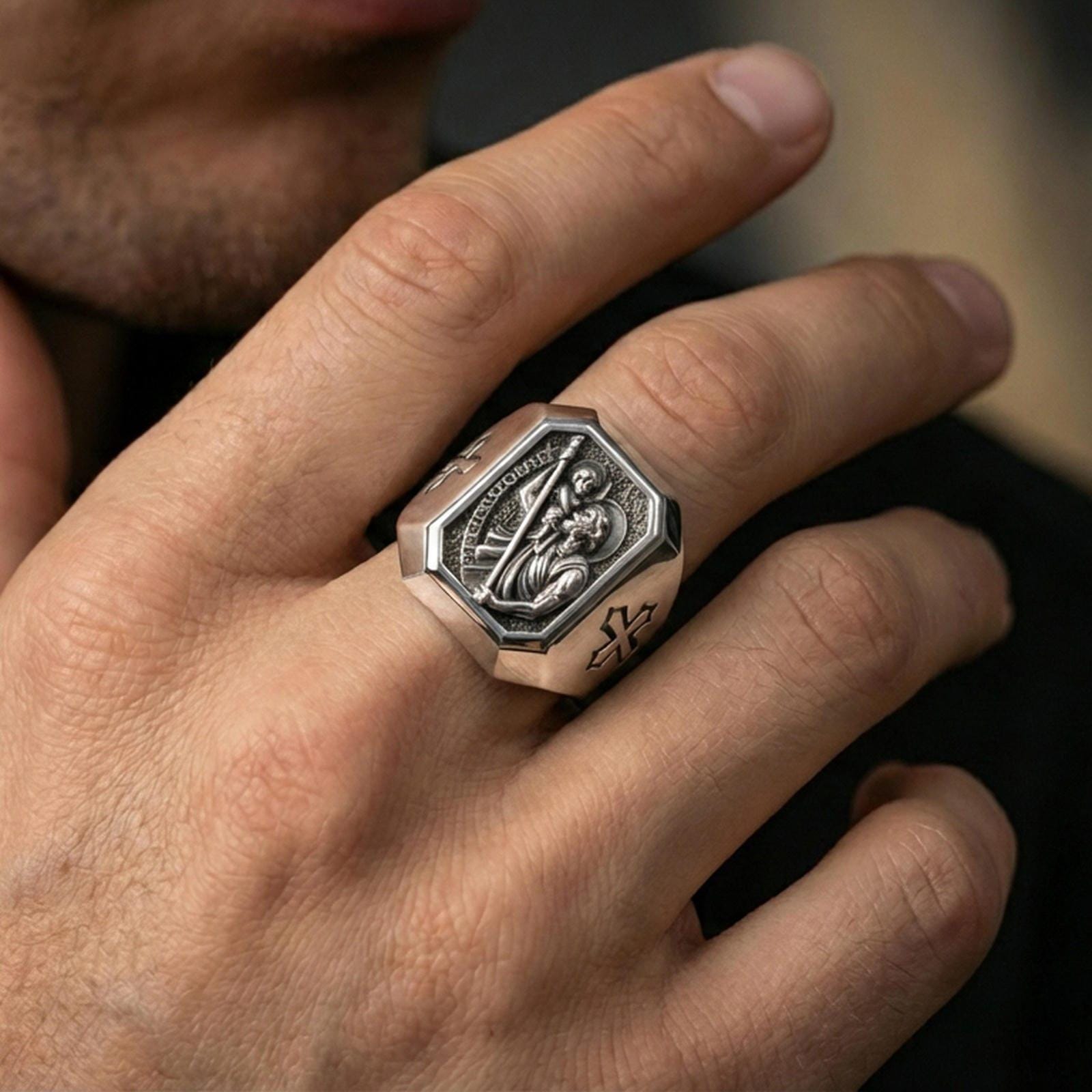 Polished silver St Christopher signet ring worn on finger, Catholic patron saint traveler ring, lifestyle close-up