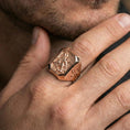 Load image into Gallery viewer, Rose gold plated Saint Michael signet ring worn on finger, Saint Michael defeating dragon relief, protective jewelry gift
