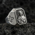 Load image into Gallery viewer, Oxidized sterling silver St Francis signet ring on volcanic rock, saint relief portrait, cross side engraving
