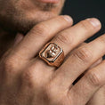 Load image into Gallery viewer, Rose gold plated cross heart signet ring worn on finger, sacred heart motif, religious jewelry gift
