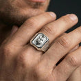 Load image into Gallery viewer, Polished silver cross heart signet ring worn on finger, sacred heart emblem, Christian devotion jewelry
