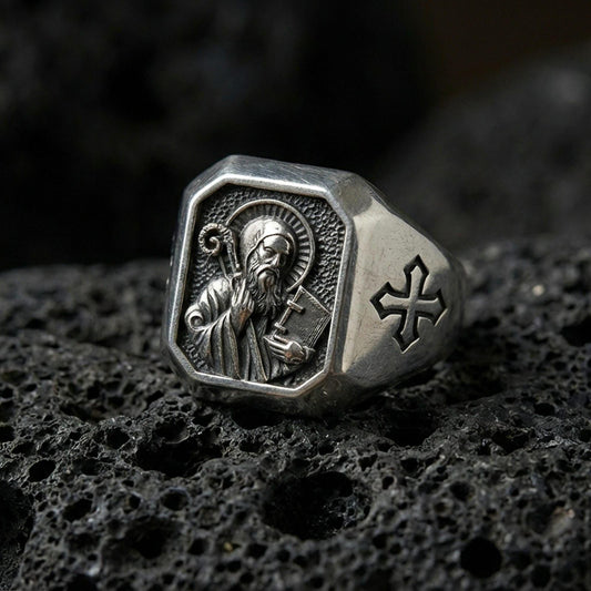 Oxidized sterling silver Saint Benedict signet ring on volcanic rock, engraved saint icon, cross shoulder detail