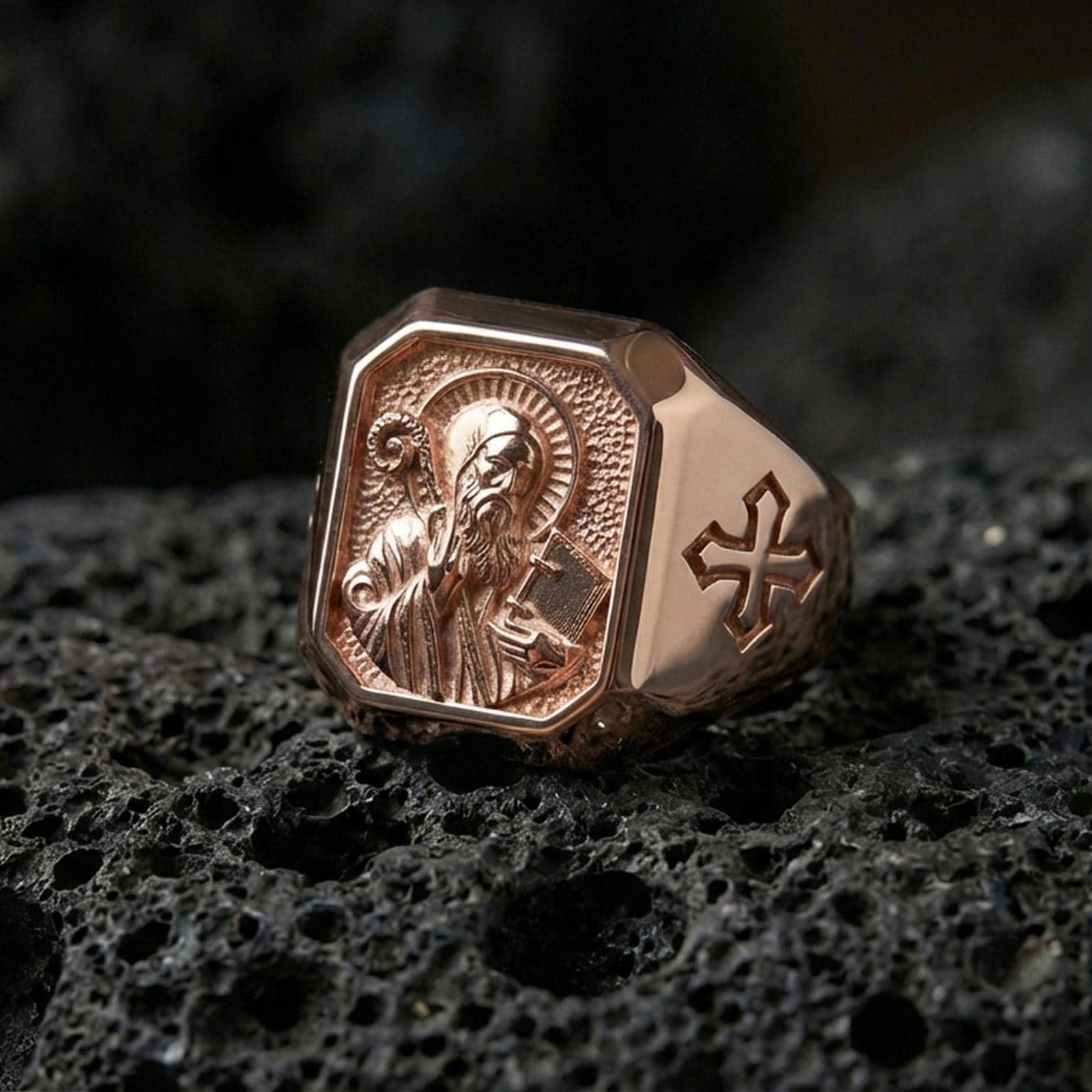 Rose gold plated Saint Benedict ring on volcanic stone, religious signet style, saint icon relief