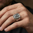 Load image into Gallery viewer, Oxidized sterling silver Saint Benedict ring worn on finger, saint relief detail, cross shoulder engraving close-up
