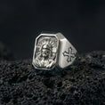 Load image into Gallery viewer, Polished silver Jesus Christ ring on porous volcanic stone, detailed Christ face engraving, Christian signet jewelry
