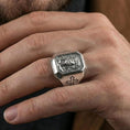 Load image into Gallery viewer, Polished silver Jesus Christ signet ring worn on finger, crown of thorns engraving, Christian faith jewelry close-up
