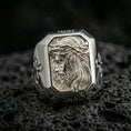 Load image into Gallery viewer, Polished silver Jesus crown of thorns signet ring on porous volcanic stone, detailed side-profile Jesus portrait, Christian ring

