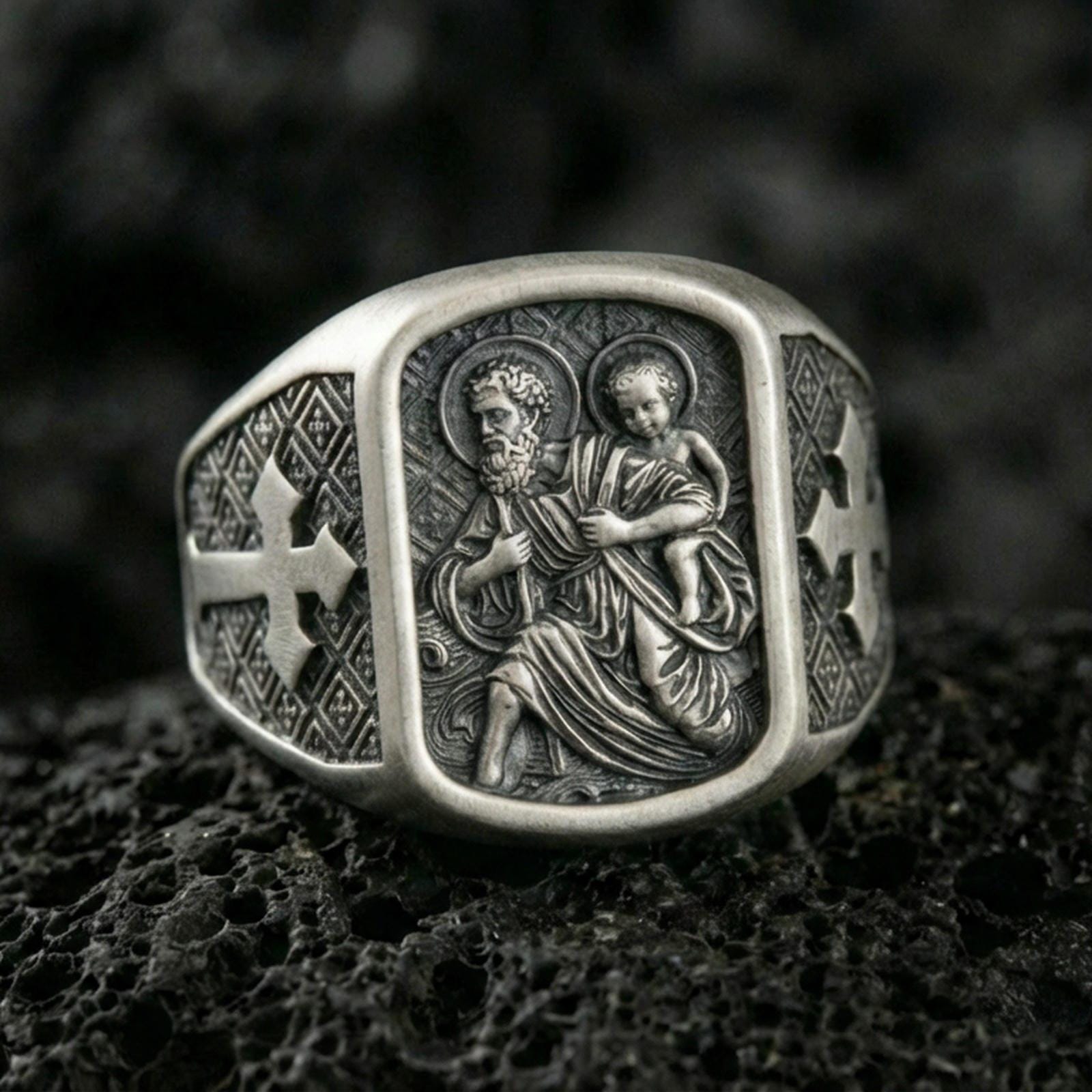 Oxidized sterling silver Saint Christopher ring on volcanic rock, patron of travelers carrying child relief, cross side engraving
