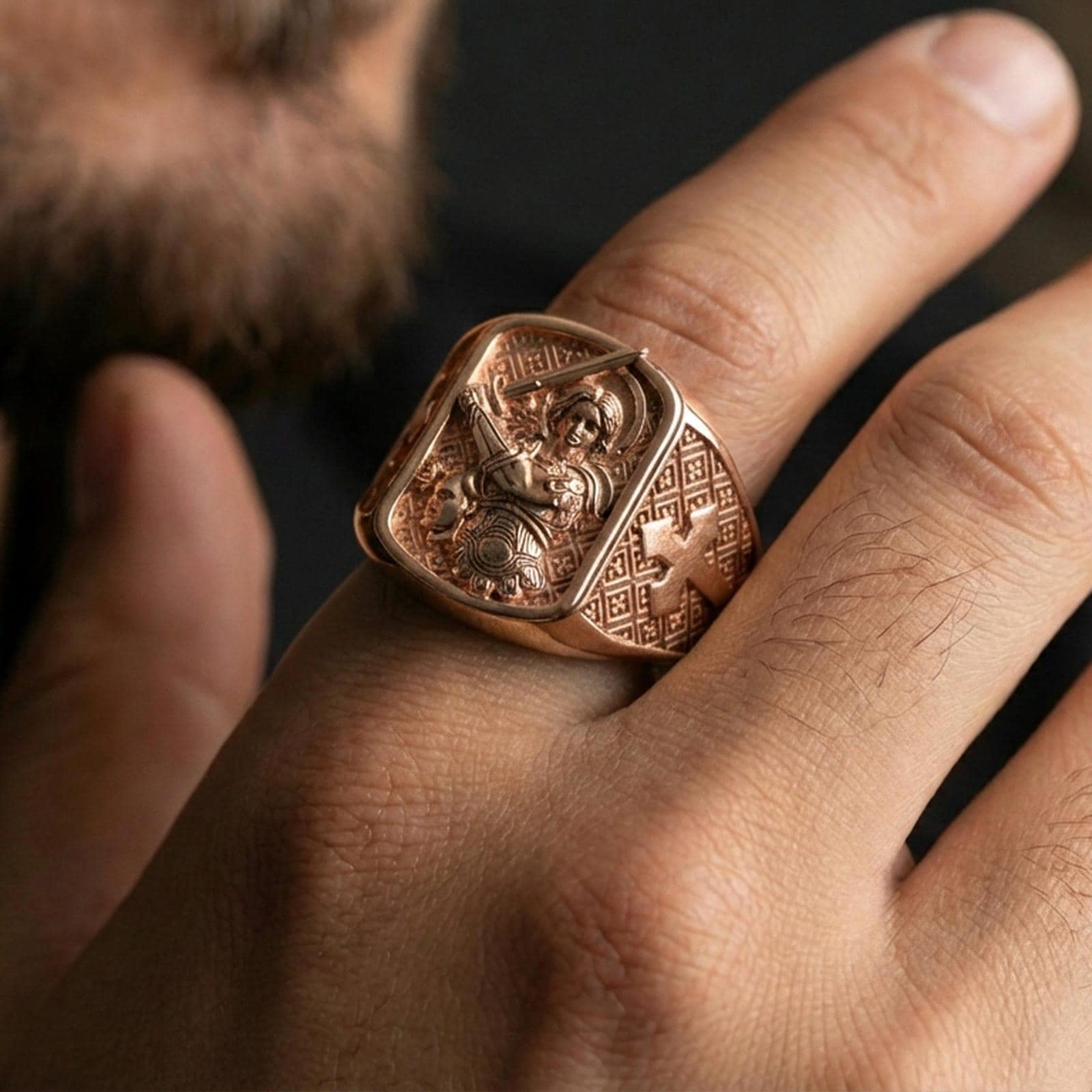 Rose gold plated Saint Michael signet ring worn on finger, archangel battle relief, meaningful faith jewelry for daily wear