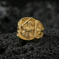 Load image into Gallery viewer, Gold plated Saint Michael archangel ring on dark volcanic rock, defeating devil relief, protective Christian jewelry gift
