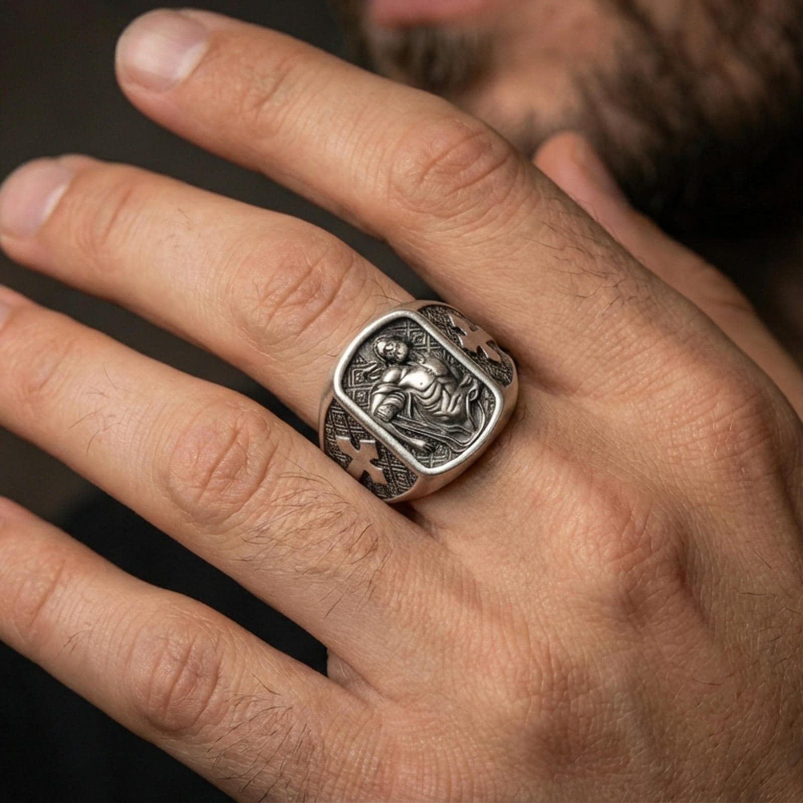 Oxidized sterling silver St Sebastian ring worn on finger, martyr saint relief, cross side details, Catholic mens jewelry