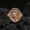 Load image into Gallery viewer, Rose gold plated Jesus portrait ring on volcanic stone, Christian faith signet ring macro detail
