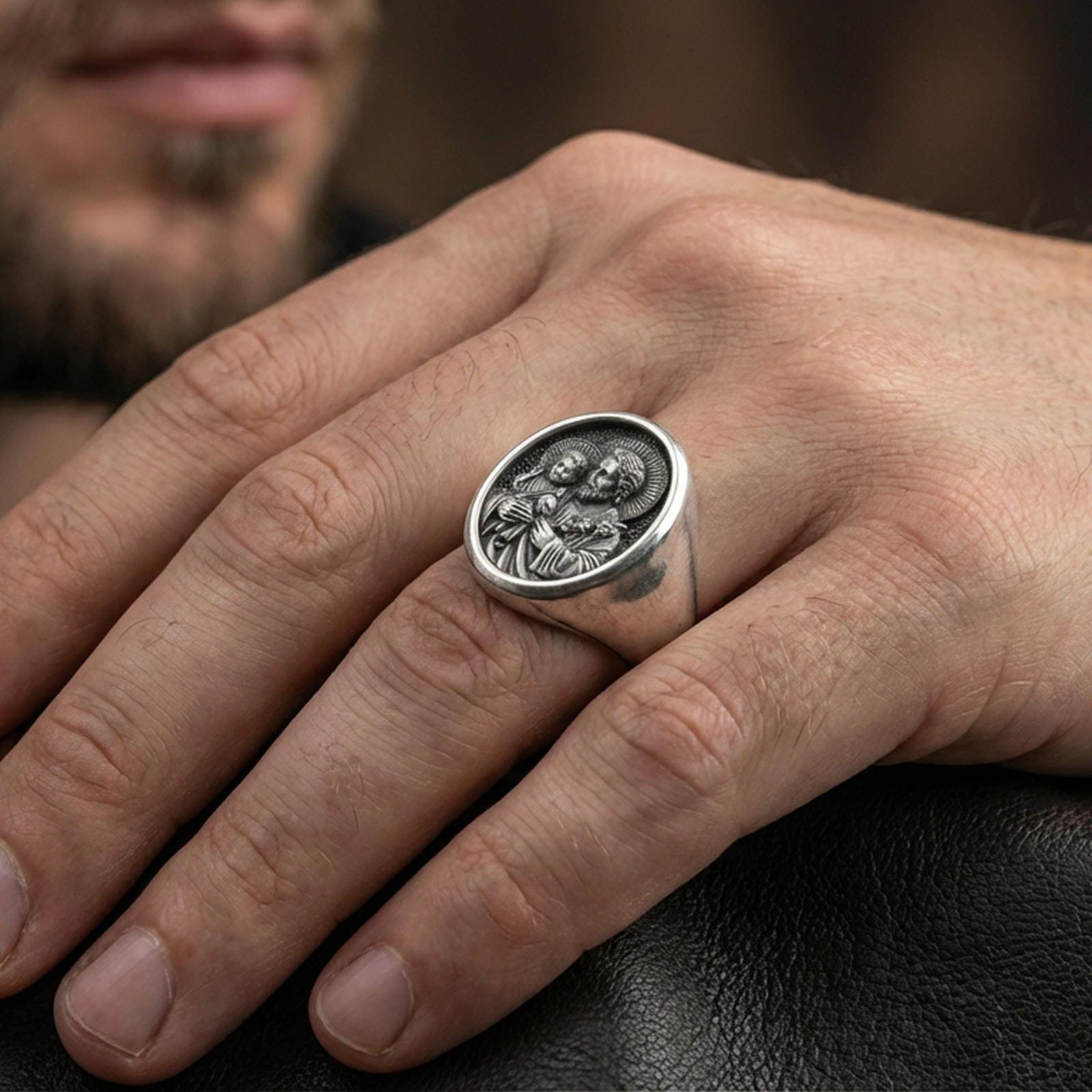 Oxidized St Joseph signet ring worn on finger, Catholic patron saint ring with Holy Family motif