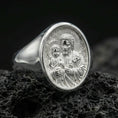 Load image into Gallery viewer, Polished silver Saint Joseph ring on volcanic stone, Catholic signet ring detailed macro
