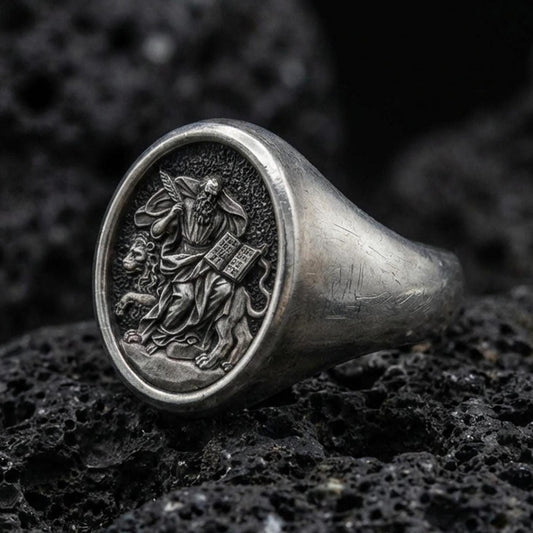 Oxidized 925 sterling silver St Mark signet ring on volcanic rock, winged lion and gospel relief