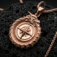 Load image into Gallery viewer, Rose gold plated dragon talisman pendant on porous volcanic rock, premium studio shadows emphasizing the sculpted relief
