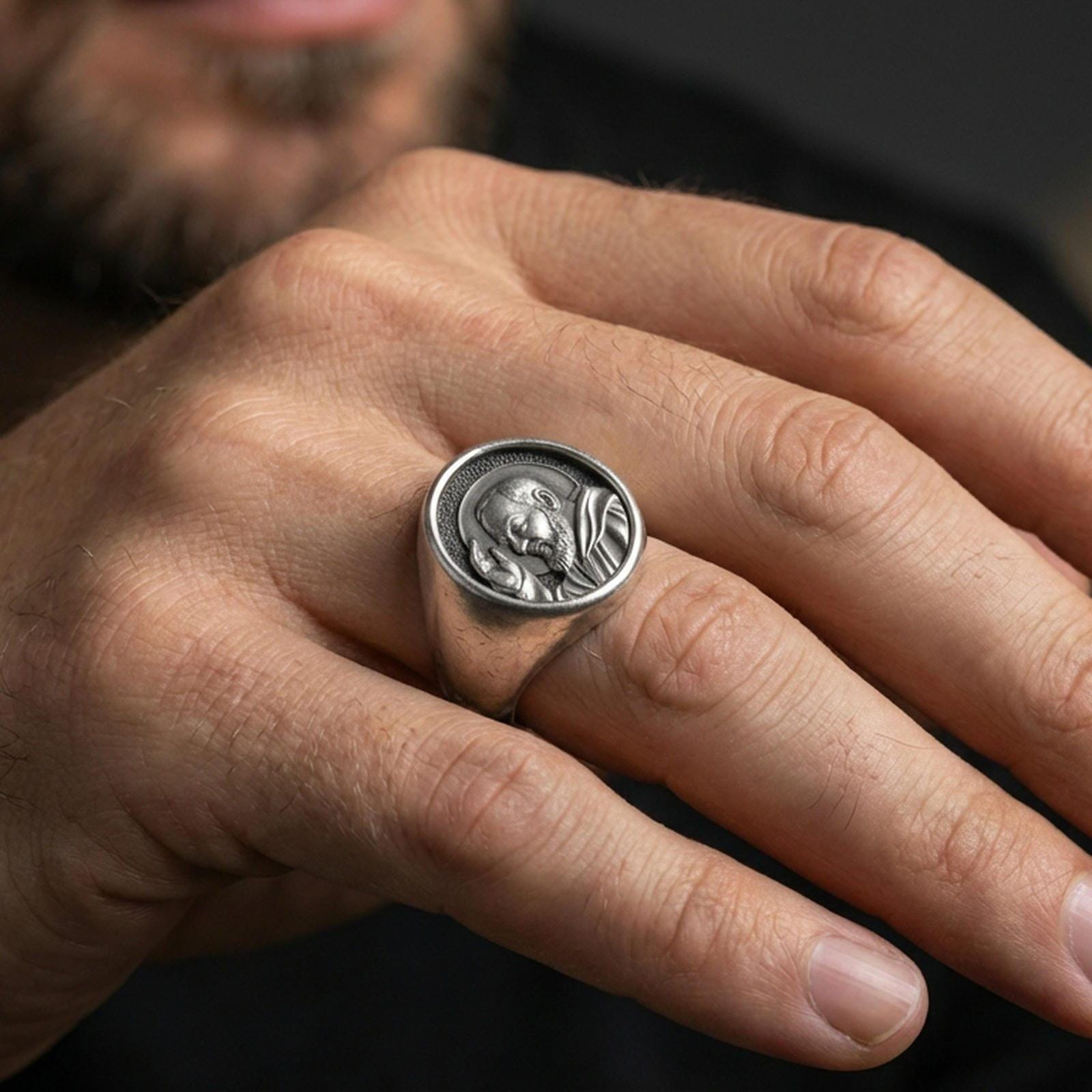 Oxidized 925 sterling silver Padre Pio ring worn on finger, saint portrait signet style, Catholic religious jewelry