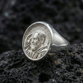 Load image into Gallery viewer, Polished silver Padre Pio ring on porous volcanic stone, detailed saint profile engraving, religious signet ring
