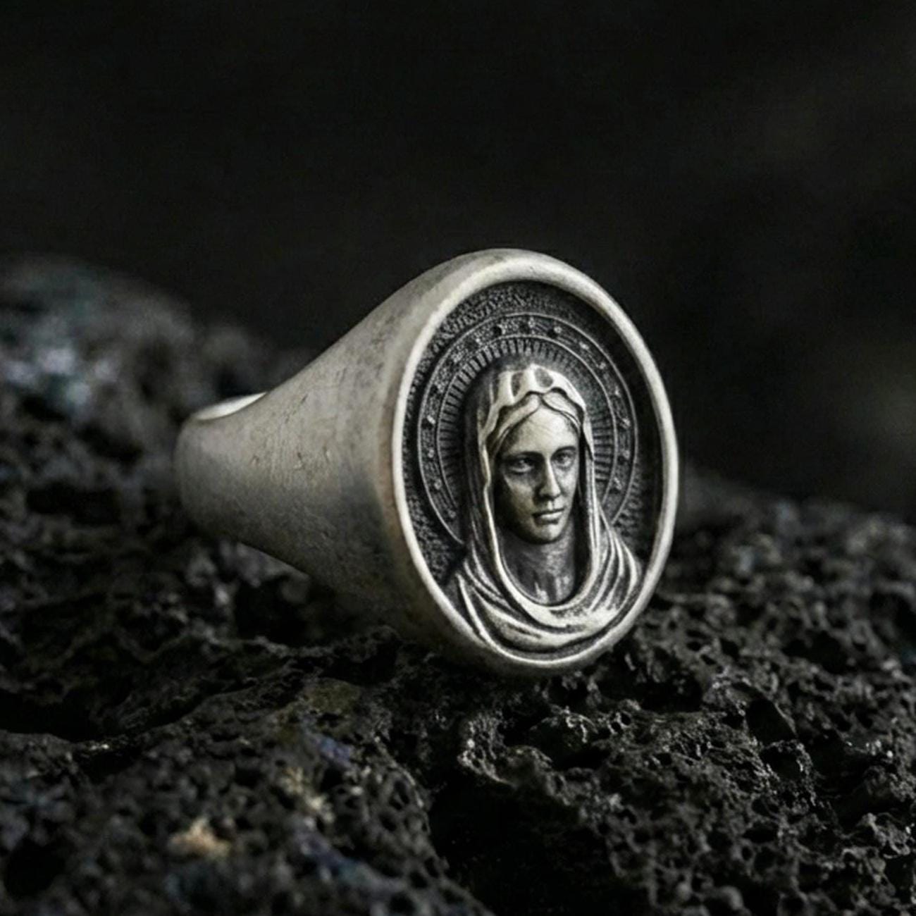 Oxidized 925 sterling silver Virgin Mary signet ring on volcanic rock, sacred portrait relief, Catholic devotional jewelry