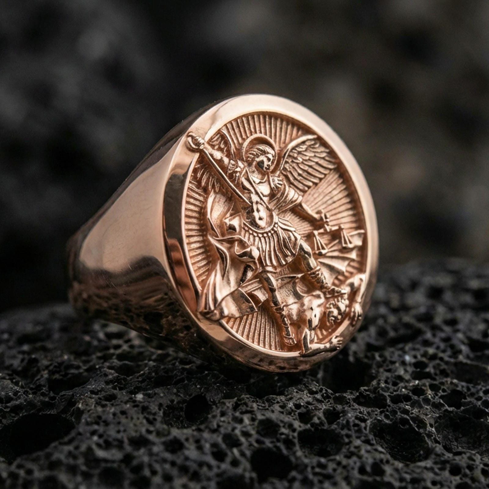 Rose gold plated St. Michael ring on volcanic stone, detailed archangel relief, faith-based Christian jewelry