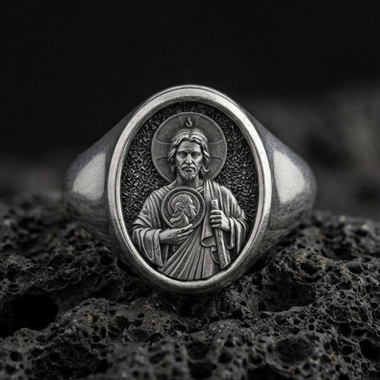 Oxidized 925 sterling silver Saint Jude signet ring on volcanic rock, halo relief portrait