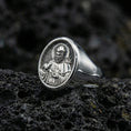 Load image into Gallery viewer, Polished silver St Francis ring on volcanic stone, Catholic devotional signet closeup
