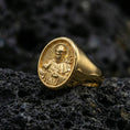 Load image into Gallery viewer, Gold plated St Francis ring on volcanic stone, Catholic saint signet ring with halo relief
