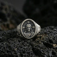 Load image into Gallery viewer, Oxidized 925 sterling silver Jesus Christ signet ring on volcanic rock, halo cross background, sacred portrait relief
